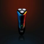 Philips Series 3000 electric shaver in a studio setting with vibrant lighting.